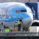 A worker stands on a platform near a Boeing 737 MAX 8 airplane being built for TUI Group at Boeing Co.’s Renton Assembly Plant Wednesday, March 13, 2019, in Renton, Wash.